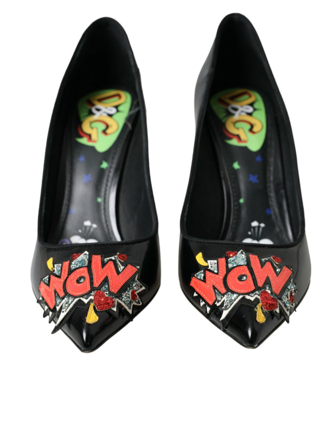 a pair of black high heels with graffiti on them