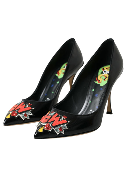 a pair of black high heeled shoes with a cartoon character on the heel