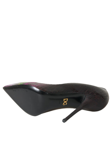 a black shoe with a gold logo on it