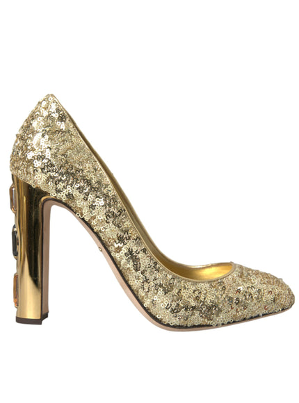 a gold high heeled shoe with a metal heel