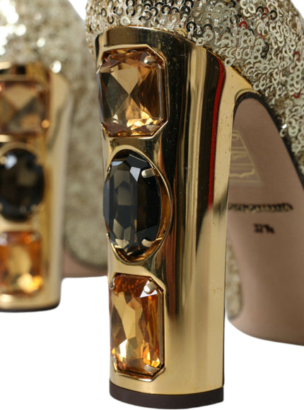 a pair of high heeled shoes with gold and black accents