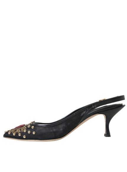 a pair of black shoes with gold studs