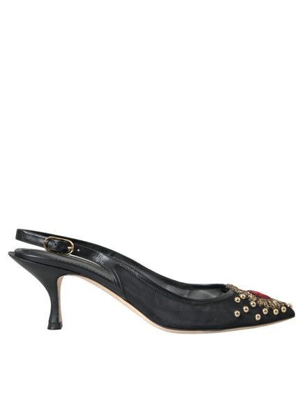 a pair of black high heels with gold studs