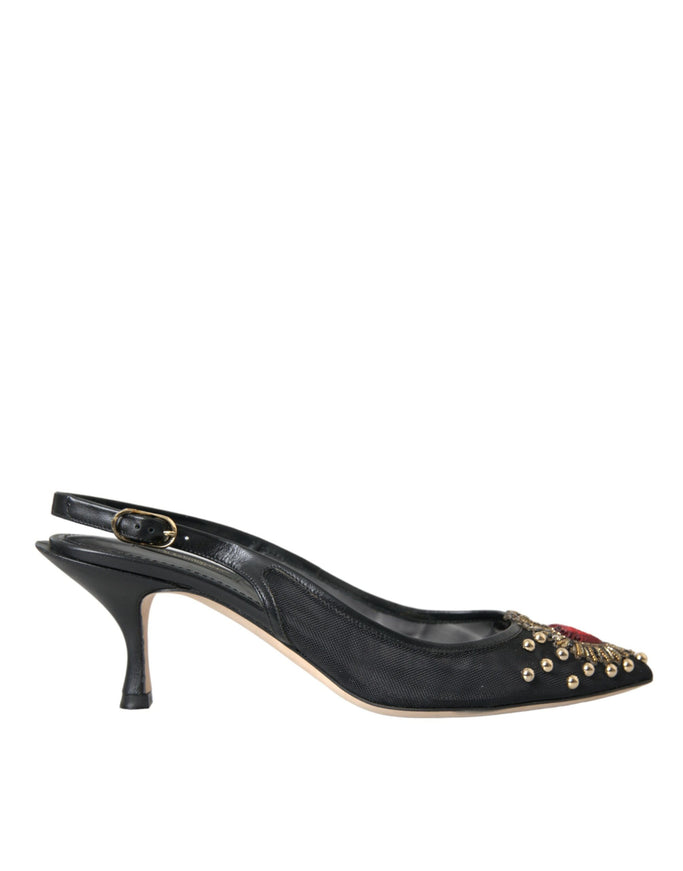 a pair of black high heels with gold studs