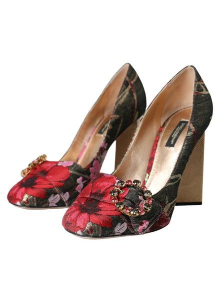 a pair of high heeled shoes with flowers on them