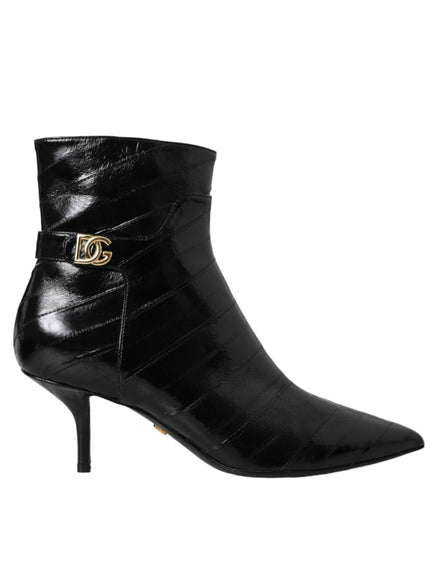 a pair of black boots with a gold buckle