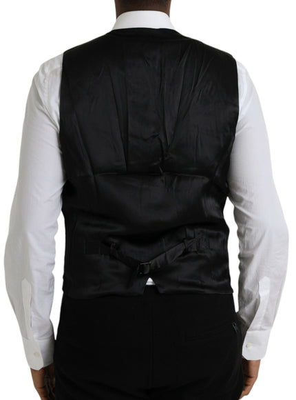 a man wearing a black vest and white shirt