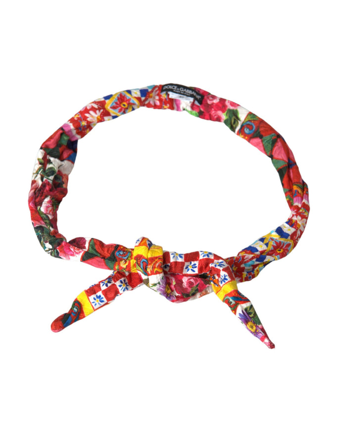 a multicolored headband with a bow on a white background