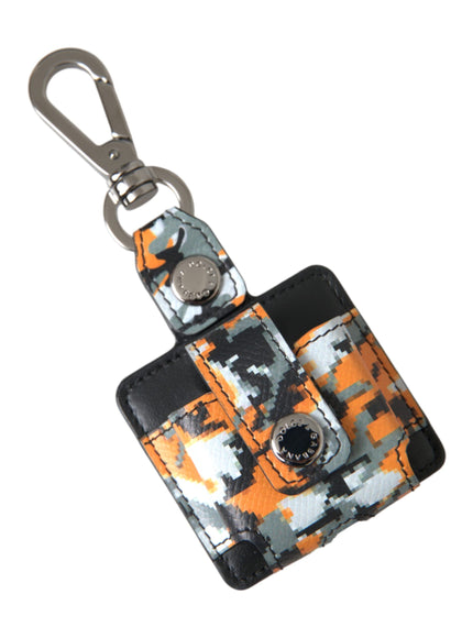 a camera keychain with an orange and black pattern