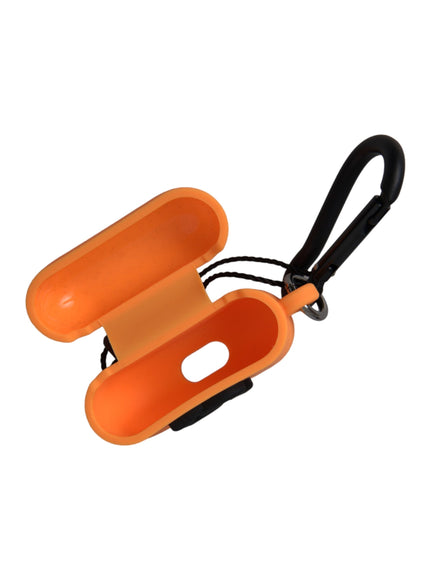 an orange object with a black handle on a white background