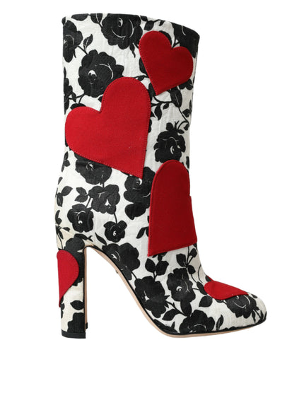 a pair of high heeled boots with hearts on them