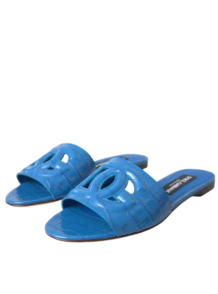 a pair of blue sandals with a knot on the toe