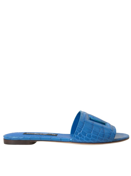 a women's blue slipper with an alligator skin pattern