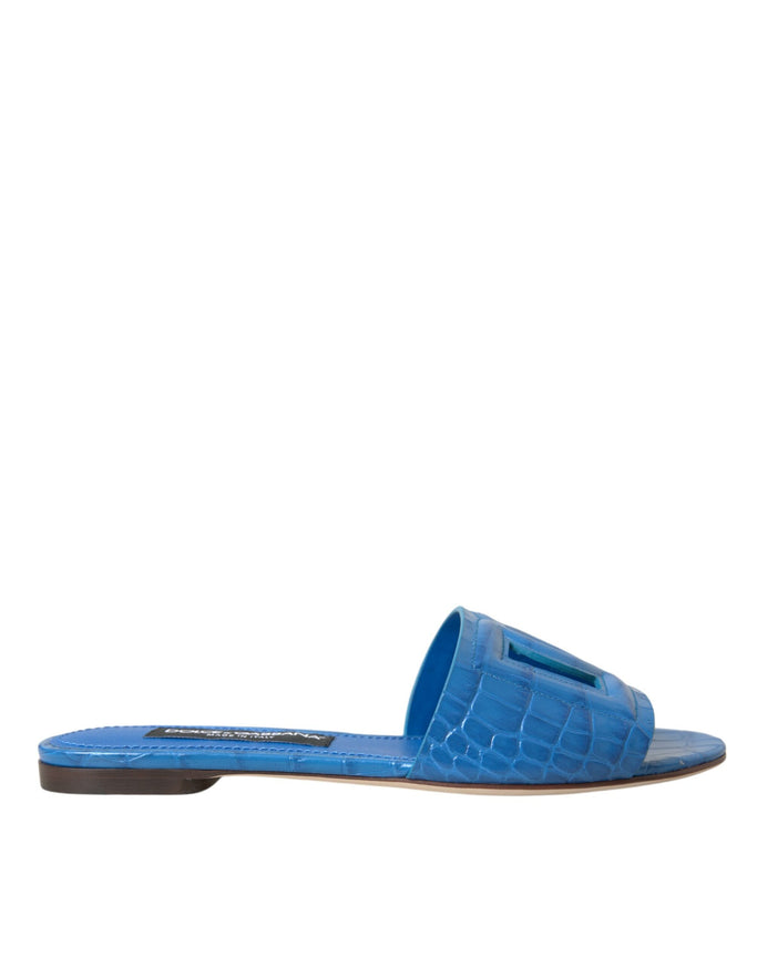 a women's blue slipper with an alligator skin pattern