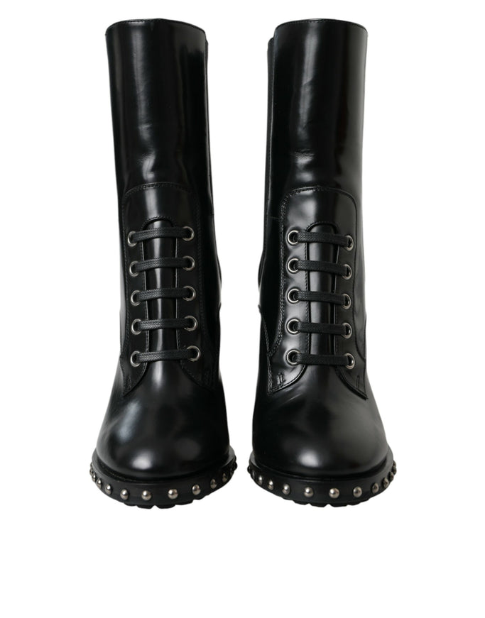 a pair of black leather boots with rivets