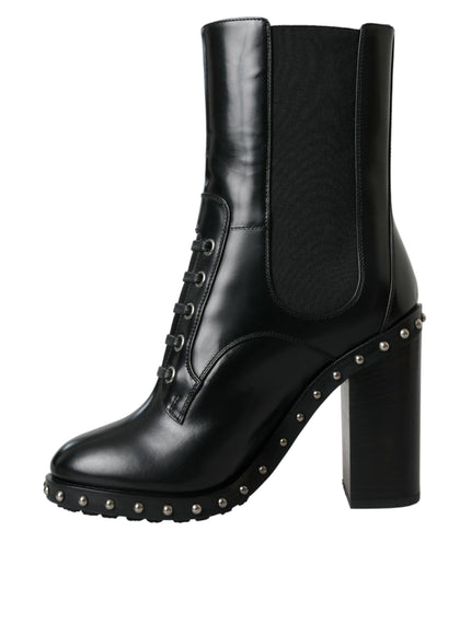 a pair of black leather boots with rivets