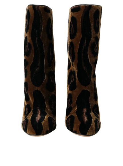 a pair of leopard print boots on a white background