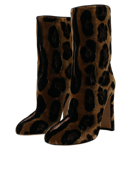 a pair of leopard print boots on a white background