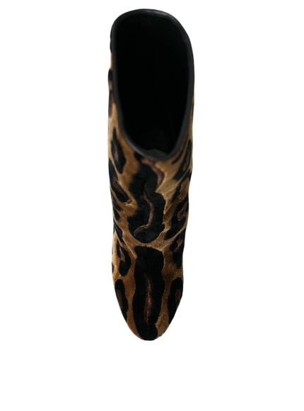 a pair of leopard print shoes on a white background