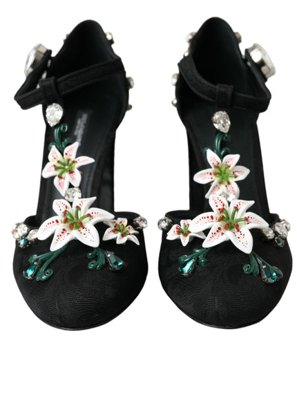 a pair of black shoes with white flowers on them