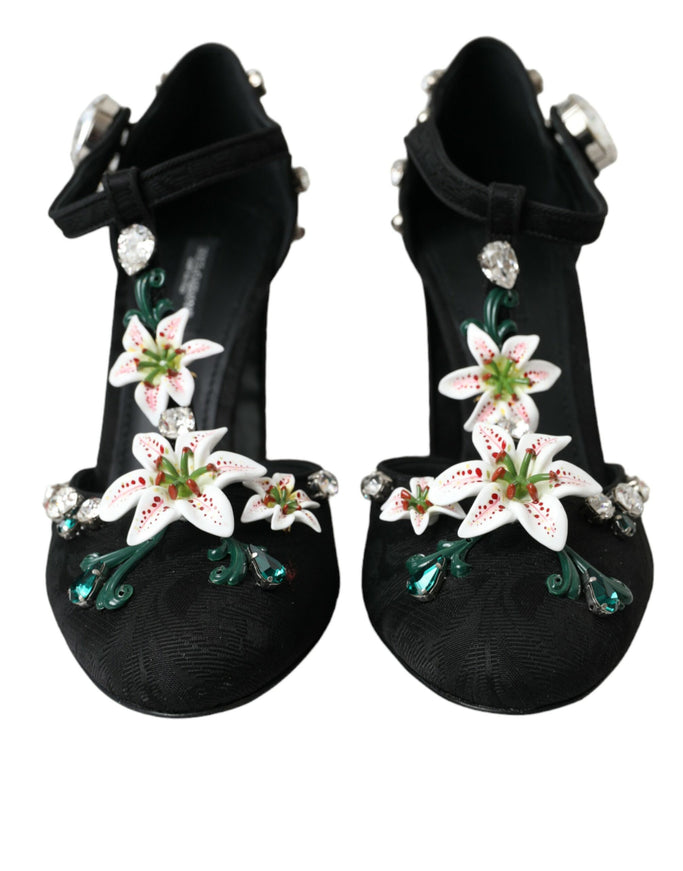 a pair of black shoes with white flowers on them