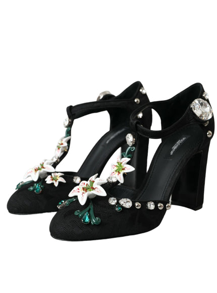 a pair of black high heels with flowers on them