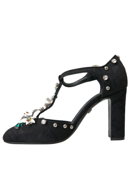 a black high heeled shoe with pearls and pearls