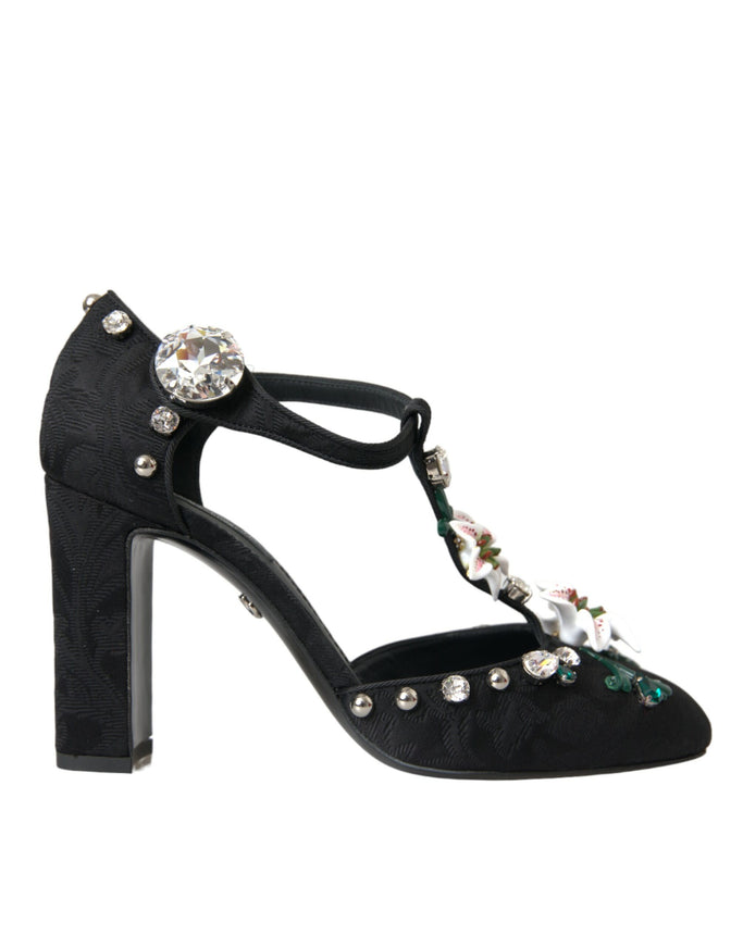 a pair of black high heeled shoes with jewel embellishments