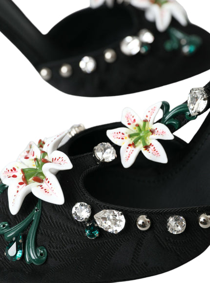 a pair of black shoes with white flowers on them