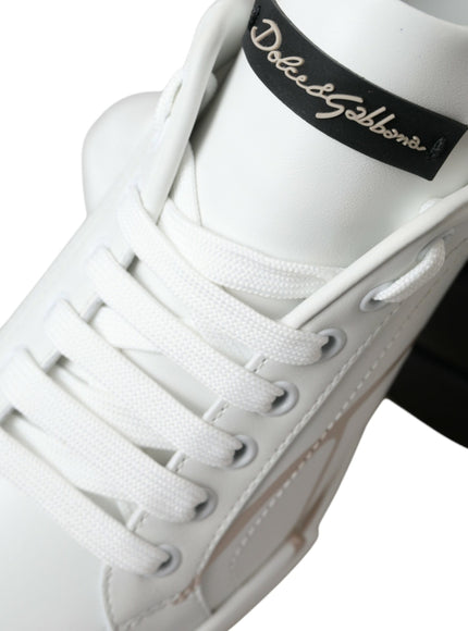 a pair of white sneakers with black laces