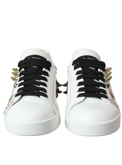 a pair of white sneakers with black laces