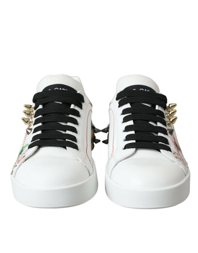 a pair of white sneakers with black laces