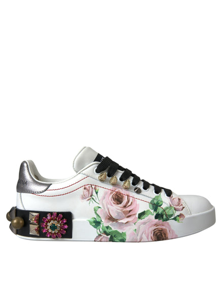 a pair of white sneakers with pink roses on them