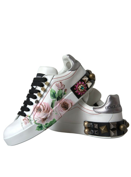 a pair of white shoes with flowers on them