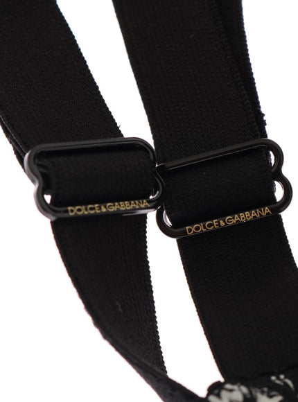 a close up of a black and white dog harness