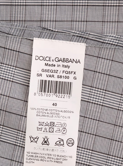 a label on the back of a plaid shirt