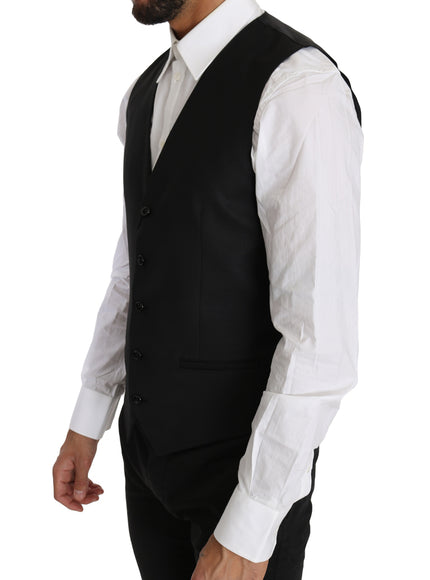 a man wearing a black vest and white shirt