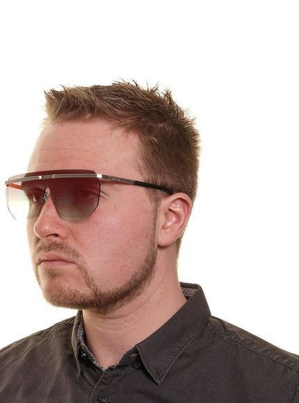 a man with a pair of sunglasses on his head