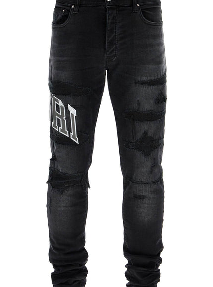 Amiri skinny jeans with varsity logo