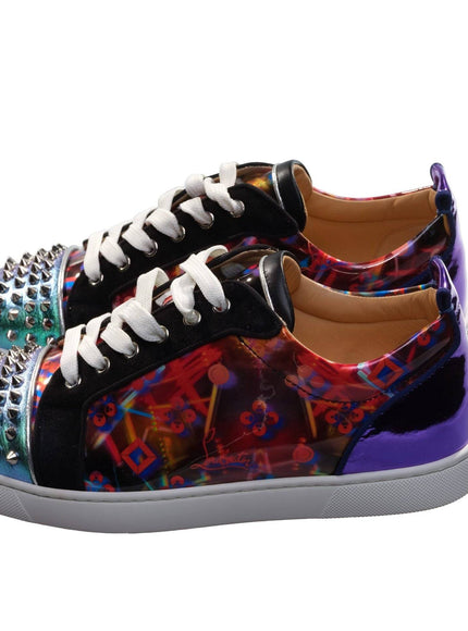 a pair of colorful shoes with spikes on them