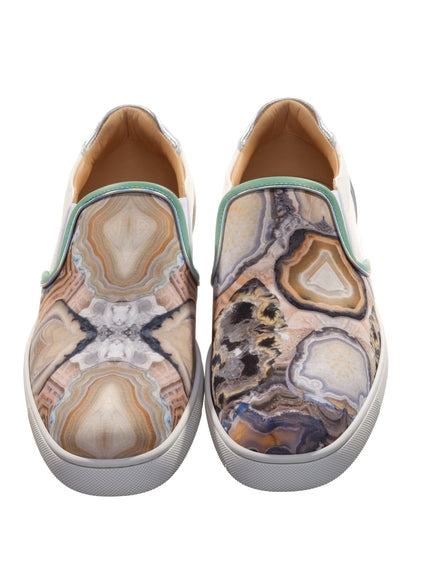 a pair of shoes with a marble pattern on them