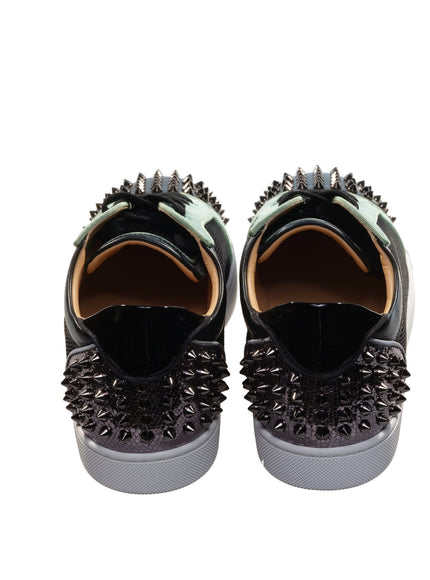 a pair of shoes with spikes on them