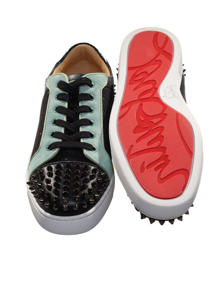 a pair of shoes with spikes on them