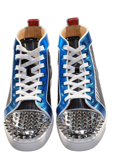 a pair of sneakers with spikes on them