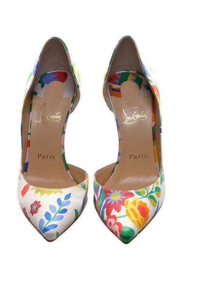 a pair of colorful floral shoes on a white background