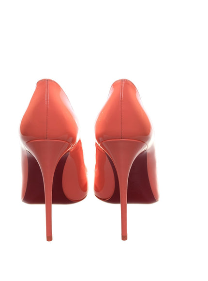 a pair of red high heels on a white background