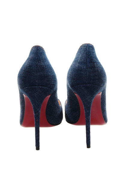 a pair of blue shoes with red soles