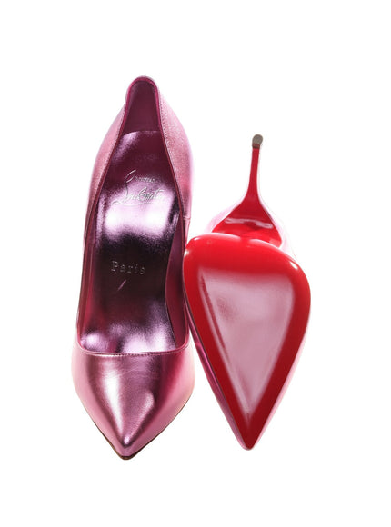 a pair of red high heeled shoes with a pointed toe