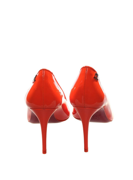 a pair of red high heels on a white background