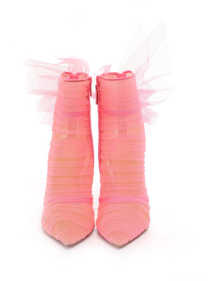 a pair of pink boots with a bow on the side